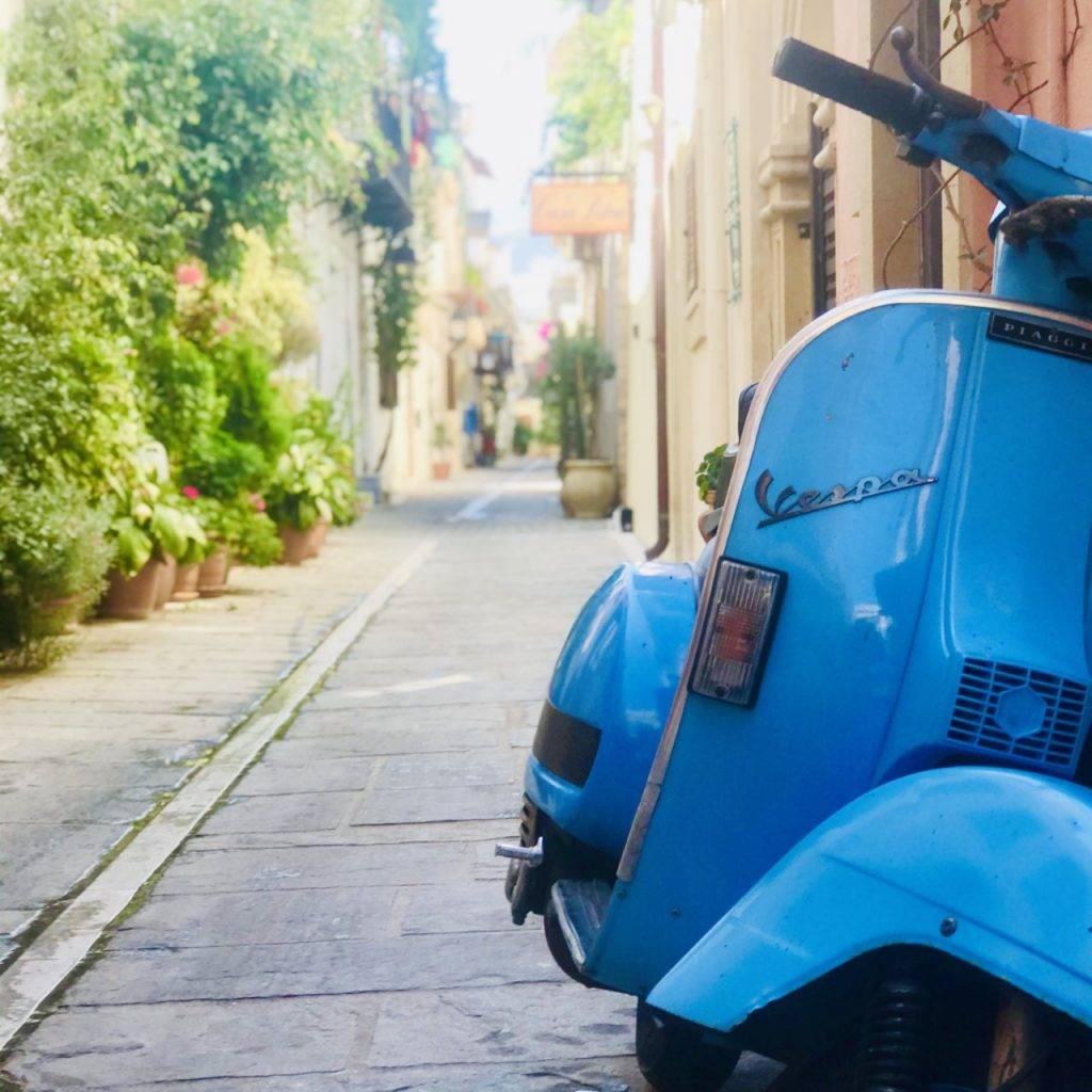 Scooter in a small paved street in Crete, Greece